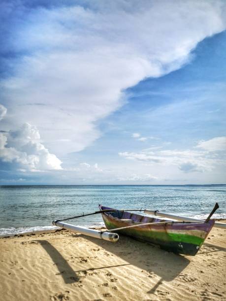 istock A traditional canoe on the beach during the low tide. 1150080715