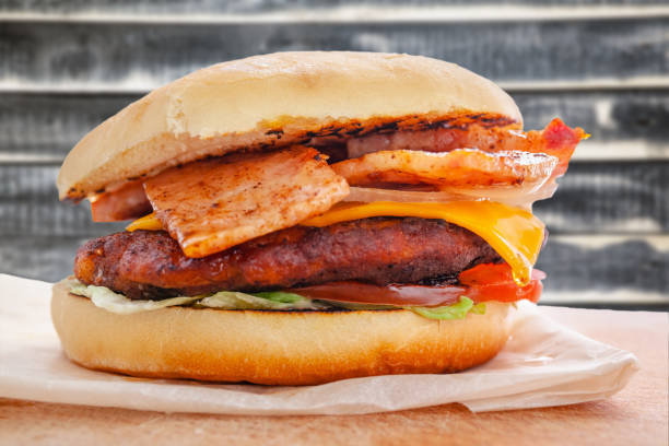 fresh flavored burger with juicy cutlet and fried bacon