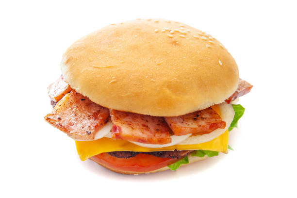istock juicy appetizing cheeseburger with a big chop and bacon, isolate, close-up 1150081452