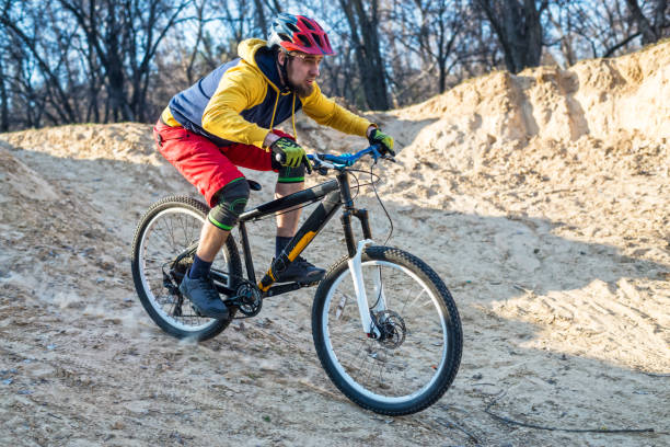 istock Mountain bike cyclist descending from the drop, free space. Active lifestyle. 1150082565