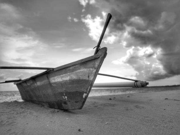 istock A traditional canoe on the beach during the low tide. 1150082756