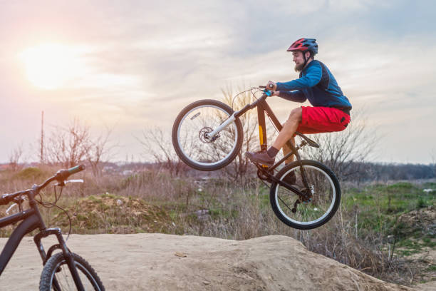 istock A man on a mountain bike performing a dirt jump. Active lifestyle. 1150082806