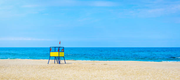 istock lifeguard tower at the beach.  background for summer postcard from vacation 1150087431