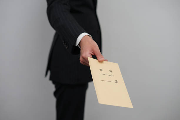 istock Businessman to pass the salary bag 1150088421