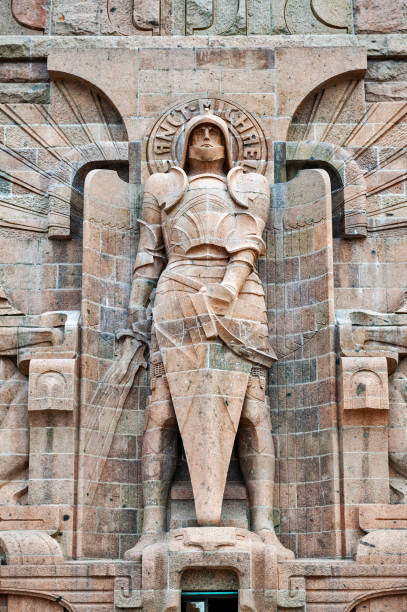 Statue of Archangel Michael at the entrance to The Monument to the Battle of the Nations in Leipzig City, Germany Leipzig, Germany - October 2018:  Statue of Archangel Michael at the entrance to The Monument to the Battle of the Nations in Leipzig City, Germany coalition building stock pictures, royalty-free photos & images