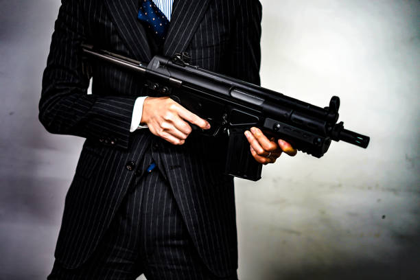 istock Businessman to fight with a machine gun 1150092641