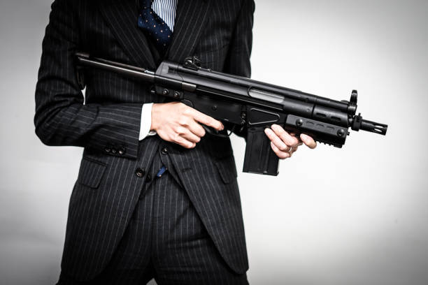 istock Businessman to fight with a machine gun 1150092662
