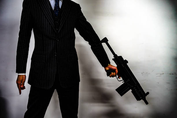 istock Businessman to fight with a machine gun 1150092666