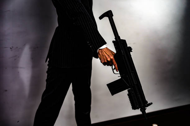istock Businessman to fight with a machine gun 1150092717
