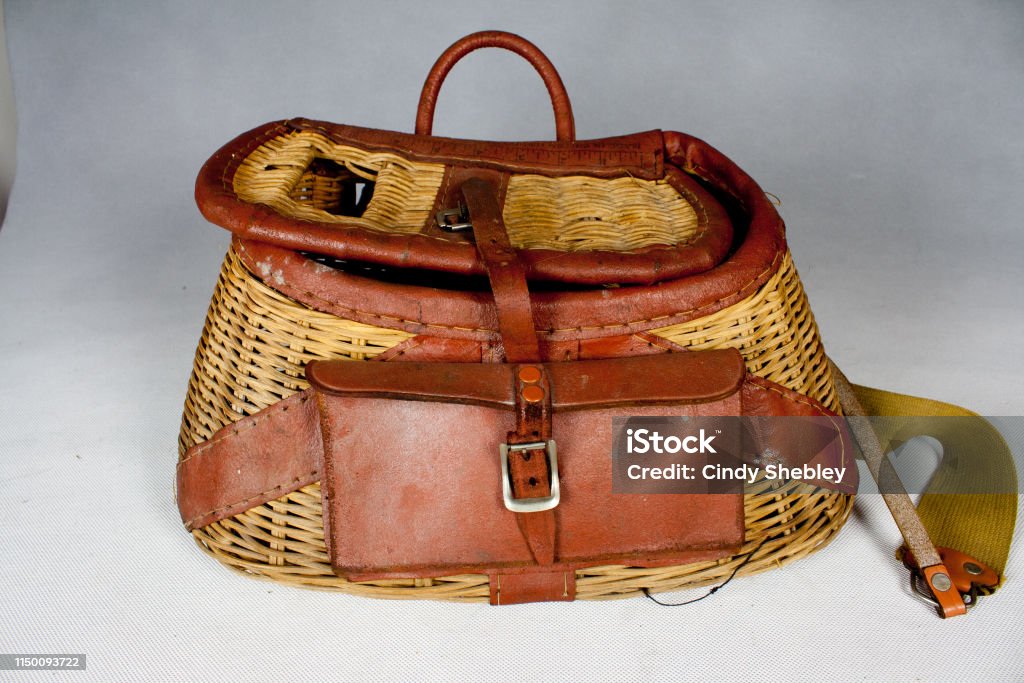 Old Leather And Wicker Basket Style Fishing Creel Stock Photo