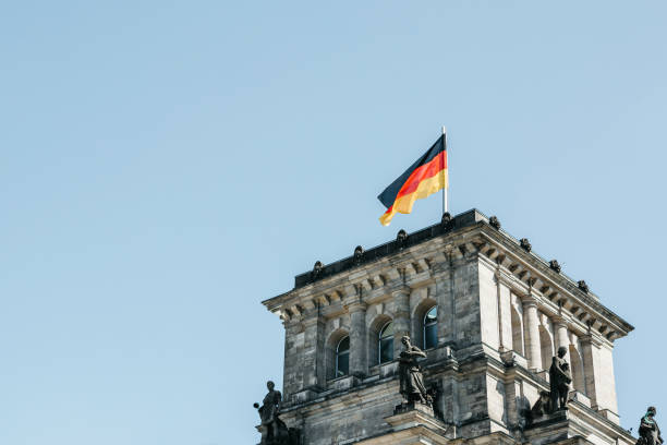 istock German flag over the Reichstag building in Berlin. 1150094250