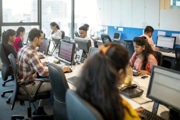 istock Female and male colleagues using computers at desk 1150094452