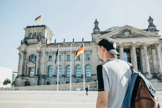 istock A guy or a tourist with a backpack next to the Reichstag building in Berlin. 1150094535