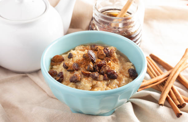 istock Cinnamon Raisin Oatmeal on a Tan Burlap Cloth 1150096381