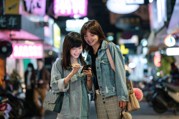 istock Two young women looking at a smartphone 1150096949