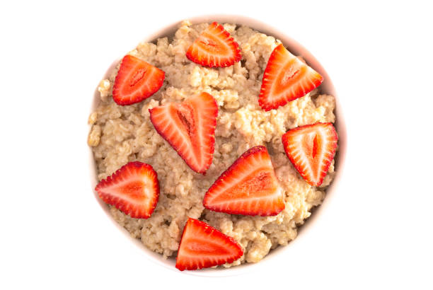 istock Oatmeal with Strawberries Isolated on a White Background 1150097141