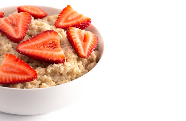istock Oatmeal with Strawberries Isolated on a White Background 1150097174