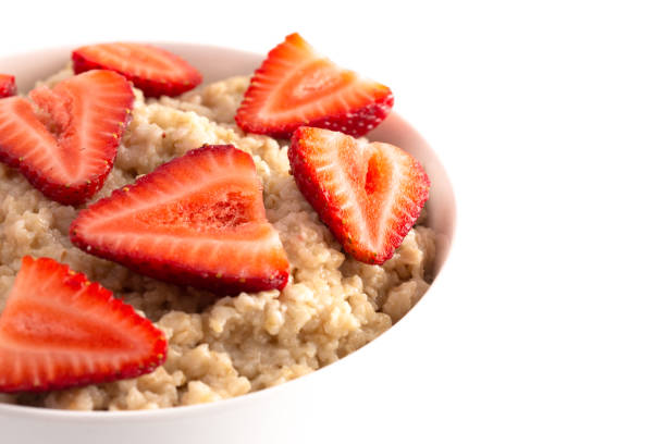 istock Oatmeal with Strawberries Isolated on a White Background 1150097294