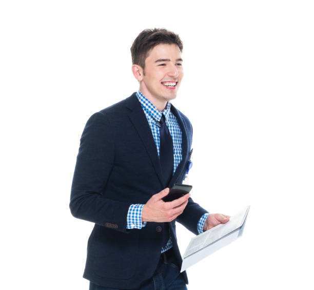 istock Attractive businessman is holding phone and clipboard 1150100097