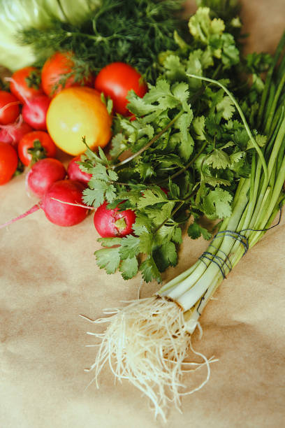 Healthy food background. Assortment of fresh vegetables on paper background