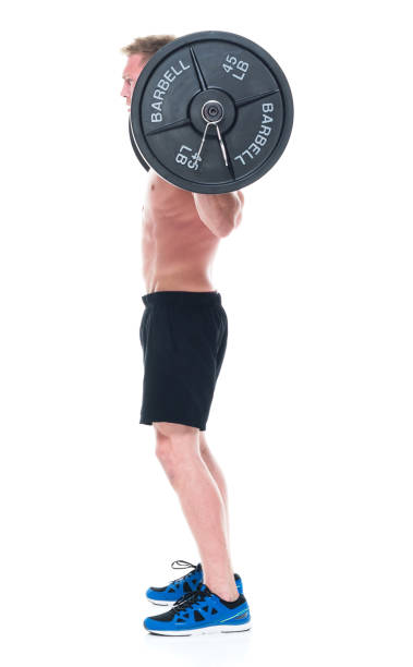 istock Attractive shirtless man lifting heavy weights, side view 1150106946
