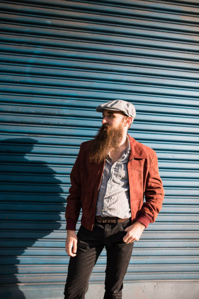 istock hipster portrait with arm crossed against the wall 1150107014