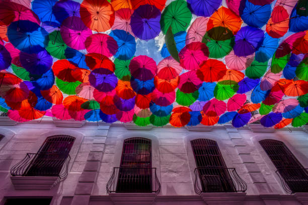 istock Umbrellas in colonial street 1150107026