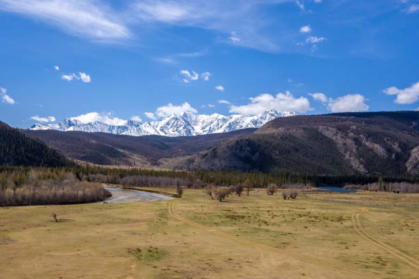 istock Mountain view with white snowy peaks and blue sky 1150108021