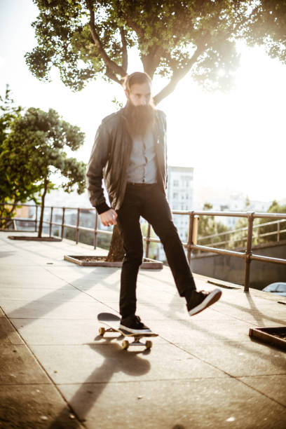 istock hipster with his skateboard on san francisco 1150109511