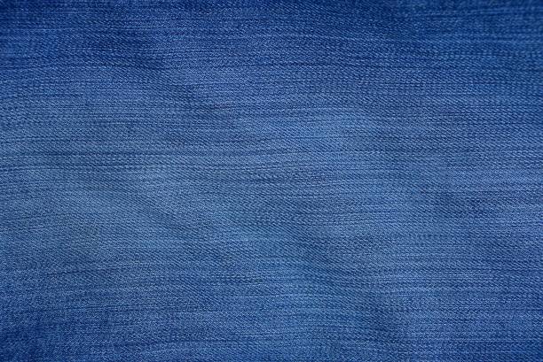 istock blue fabric texture of mashed and shabby denim 1150112682