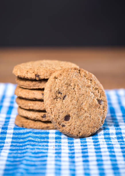 istock Delicious cookies and cloth on a wooden table 1150113252