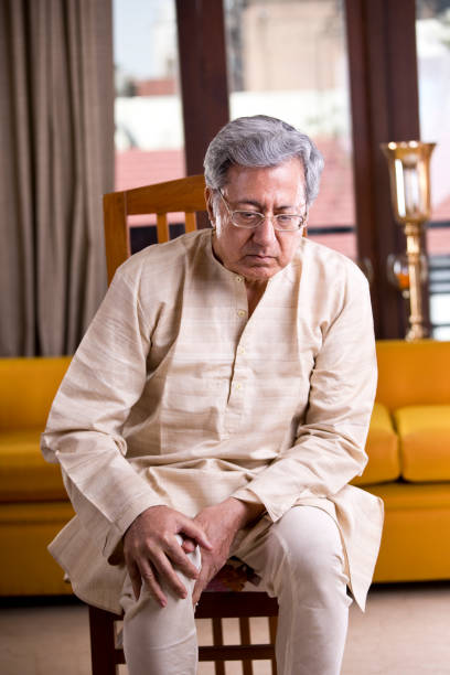 istock Senior man holding his painful knee 1150114766
