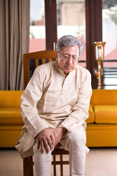 istock Senior man holding his painful knee 1150114885