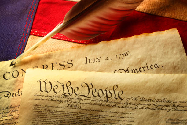 istock Feather Quill On U.S. Constitution And American Flag 1150115039