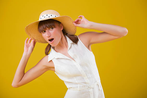 istock surprised woman in summer hat 115011765