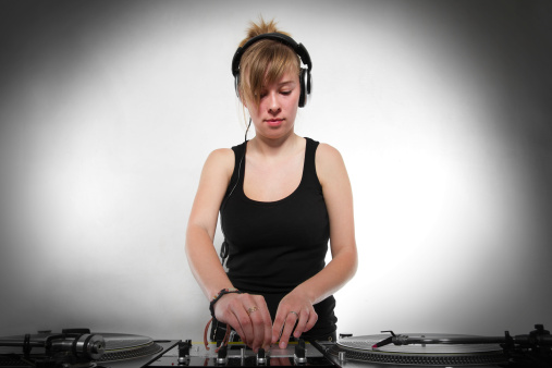 Late teenager chick playing hip-hop from vinyl records