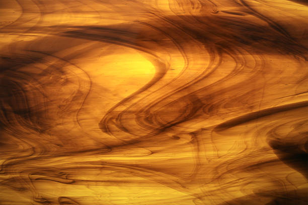 hell gelb/brauner buntglas - abstract swirl curve ethereal stock-fotos und bilder
