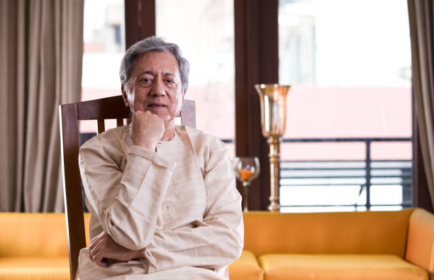 istock Senior man sitting at home 1150121079