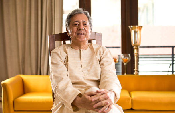 istock Senior man laughing at home 1150121144