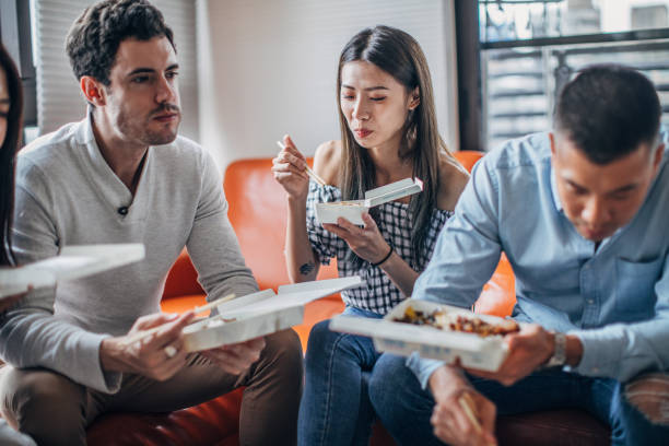 istock Group of friends eating together 1150121265