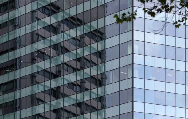istock Building is reflected in a glazed modern building office center. Europe, Bulgaria, Sofia. 1150121361