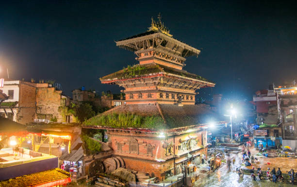 Elevated view of a traditional three-tiered Nepali temple in Nepal's capital city (night shot) - Kathmandu, Nepal