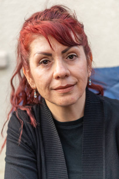 istock Smiling hispanic mature woman looking at the camera 1150123911