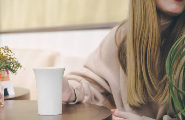 istock Beautiful woman in a cafe 1150124711