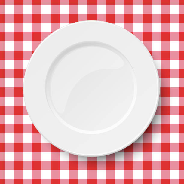 istock Empty white plate placed on a kitchen table cloth seamless background of classic red colors. Vector illuatration. 1150125592