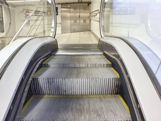istock metal escalator moving upwards.  electronic automation. 1150125653