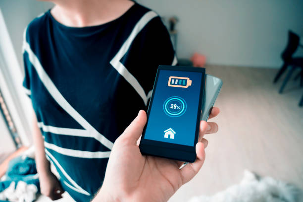 istock Point of view when charging phone without wires through another phone 1150126059