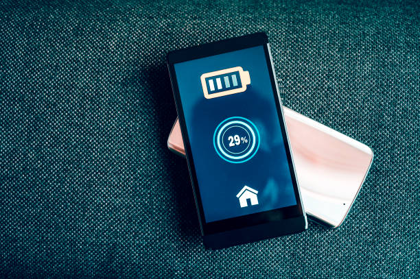 istock Two mobile phones sharing power and one smart phone gets its batteries charged 1150126081