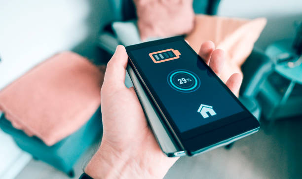 istock Sharing power between two phones by holding their backsides together 1150126126