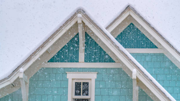 istock Clear Panorama Snow falling on a blue home in Daybreak Utah with cloudy sky in the background 1150130870